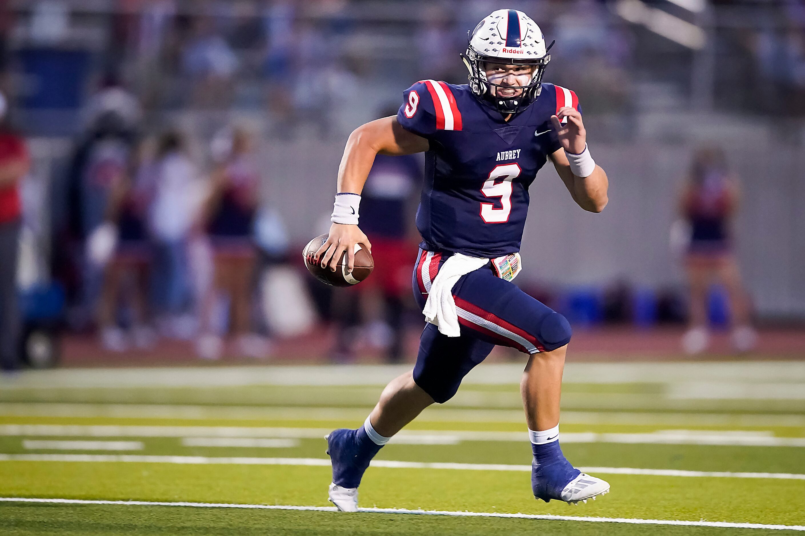 Aubrey quarterback Jaxon Holder scrambles away from the Terrell defense during the first...