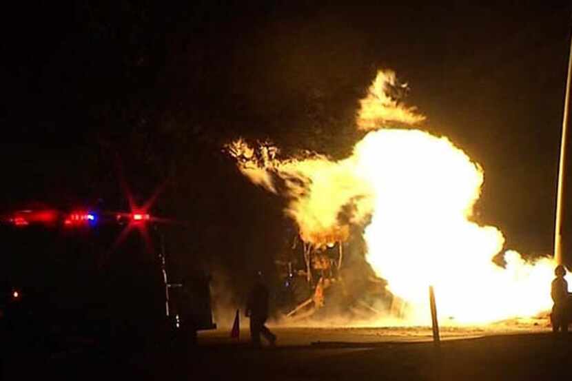 Flames shoot from a ruptured gas line near Oakbrook Parkway and Garden Brook Drive in...