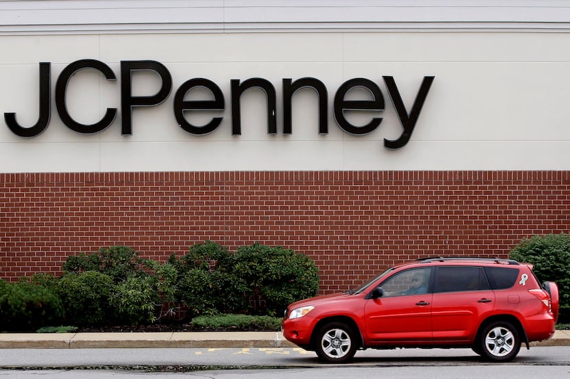 Photo taken on Friday, July 10, 2015 as a car drives through an empty J. C. Penney...