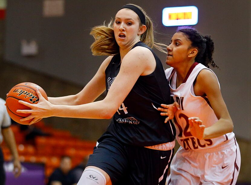 Flower Mound center Lauren Cox (44) drives the lane past El Paso El Dorado guard Ebonie...