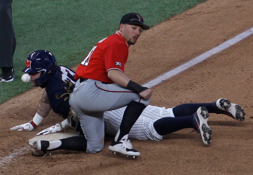 Texas Tech 3rd baseman Cal Conley (13) looks for the ball as a sliding Ben Van Cleve (33)...