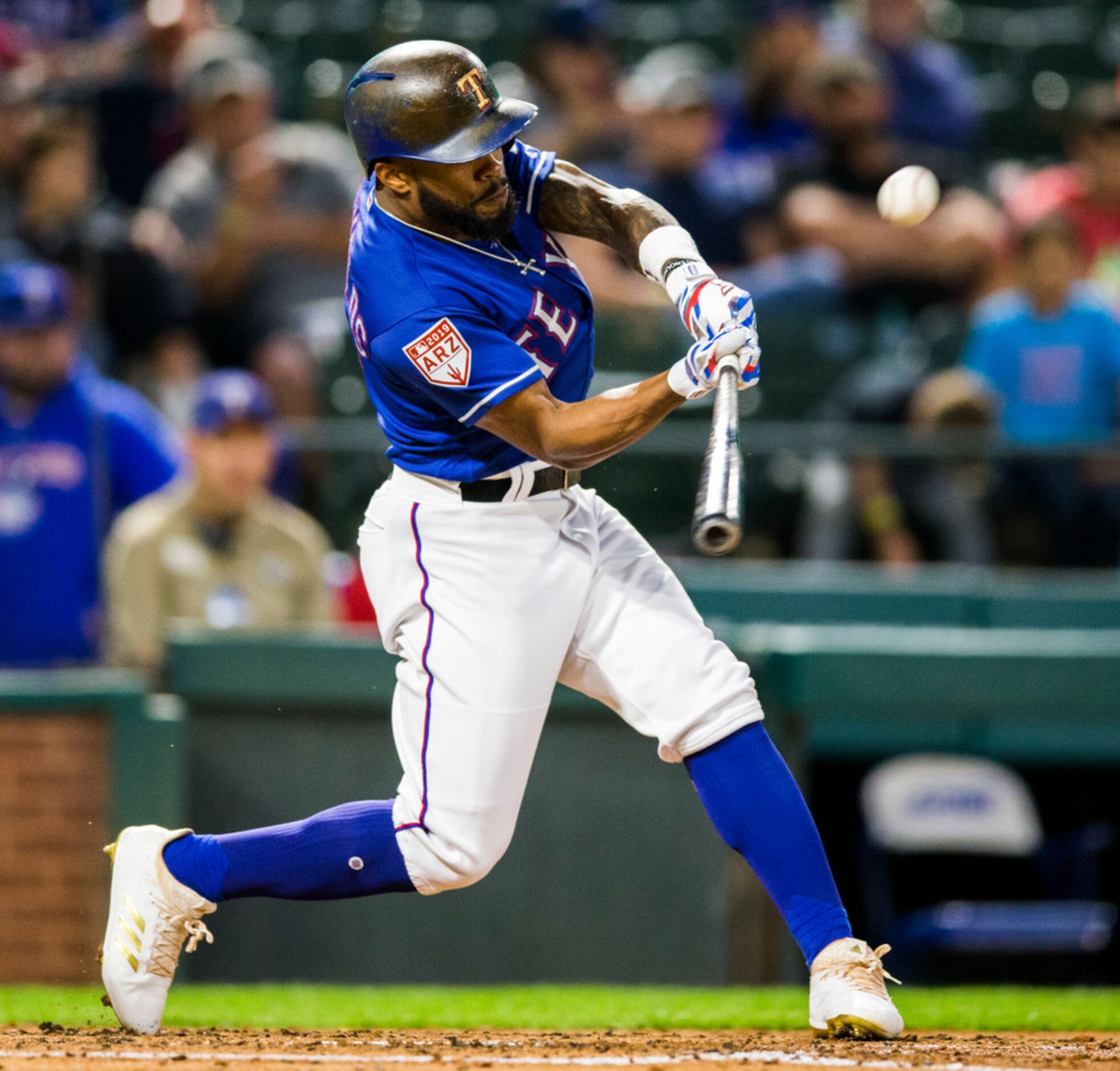 Texas Rangers center fielder Delino DeShields (3) bats during the third inning of a spring...