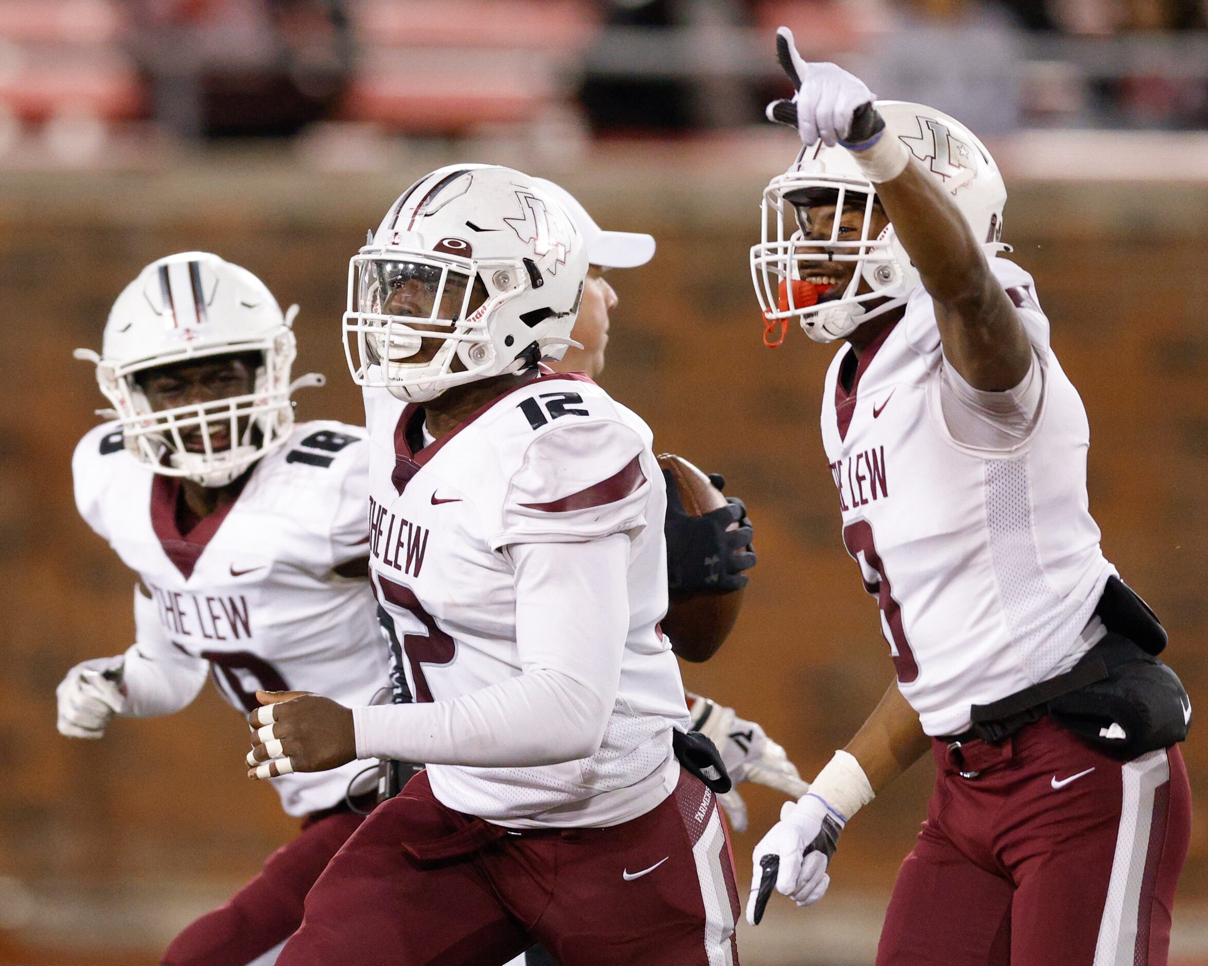 Lewisville defensives back Tye Miller (18) and Caden Jenkins (8) celebrate with linebacker...