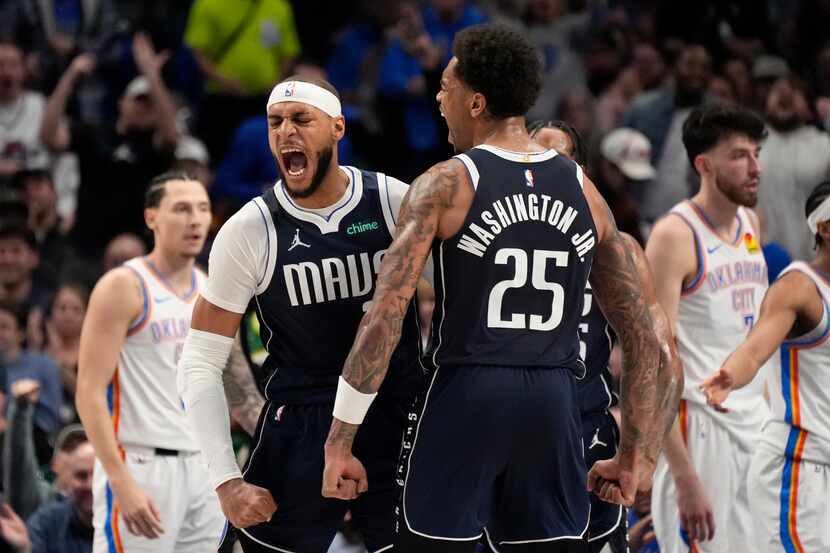 Dallas Mavericks center Daniel Gafford, left, and forward P.J. Washington (25) celebrate a...