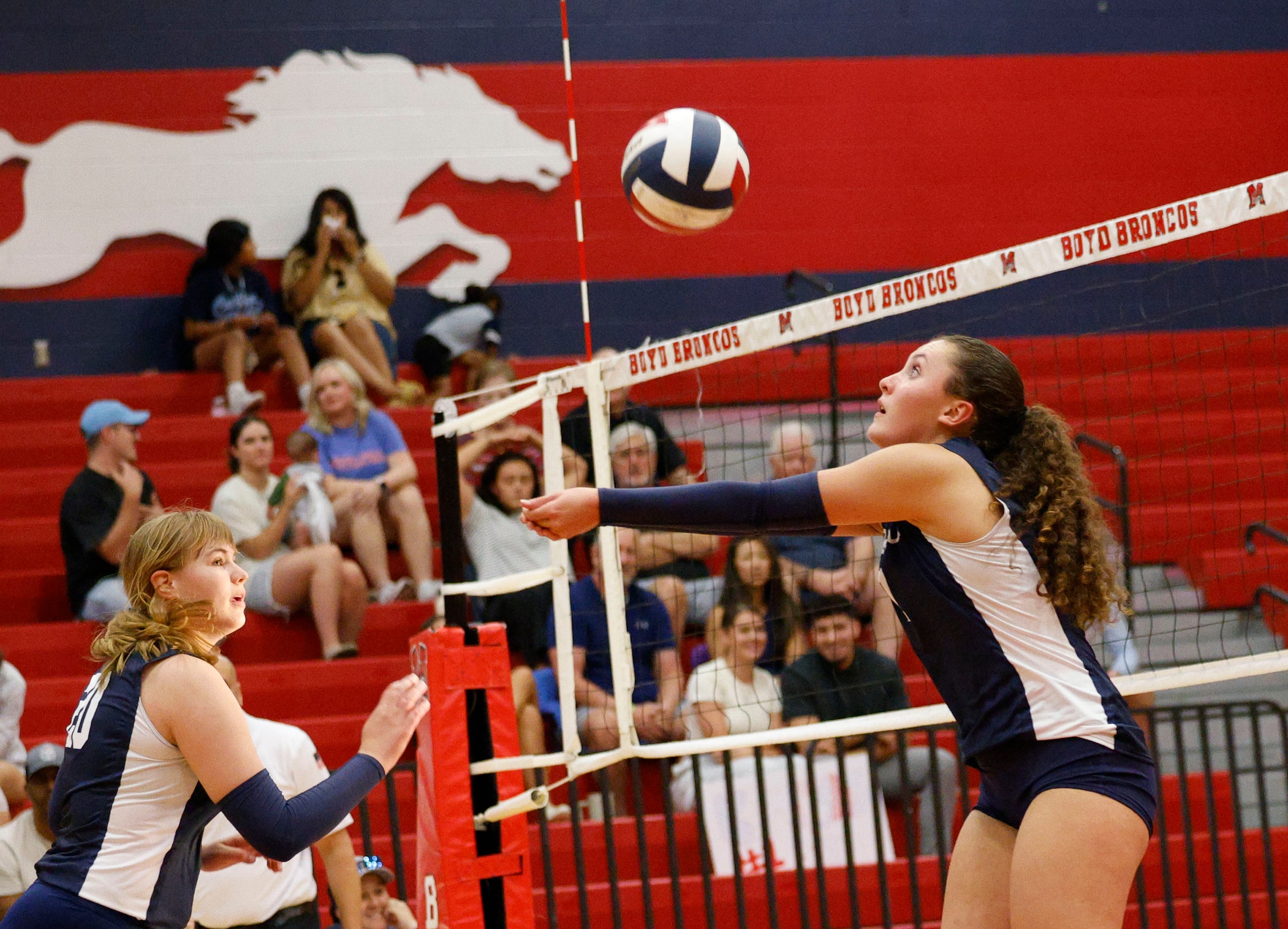 McKinney Boyd's Sara Quigley (7) digs the ball against Plano East as McKinney Boyd's Sasha...