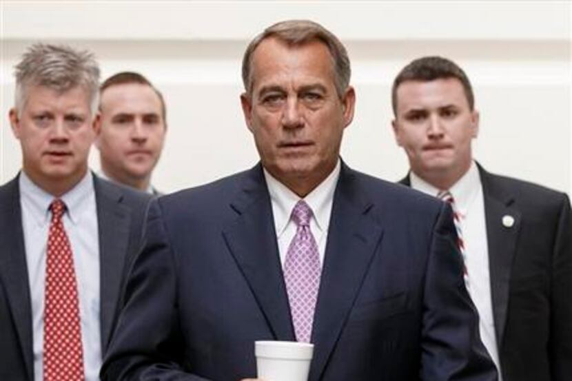 House Speaker John Boehner of Ohio walks to a Republican strategy session on Capitol Hill in...
