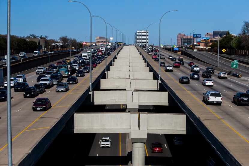 Vehicles make their way through Interstate 635 (outer lanes) and Interstate 635 Express toll...