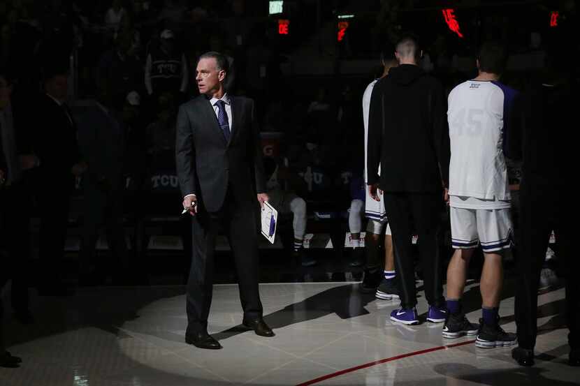 TCU Horned Frogs head coach Jamie Dixon looks across the coach before the first half of an...