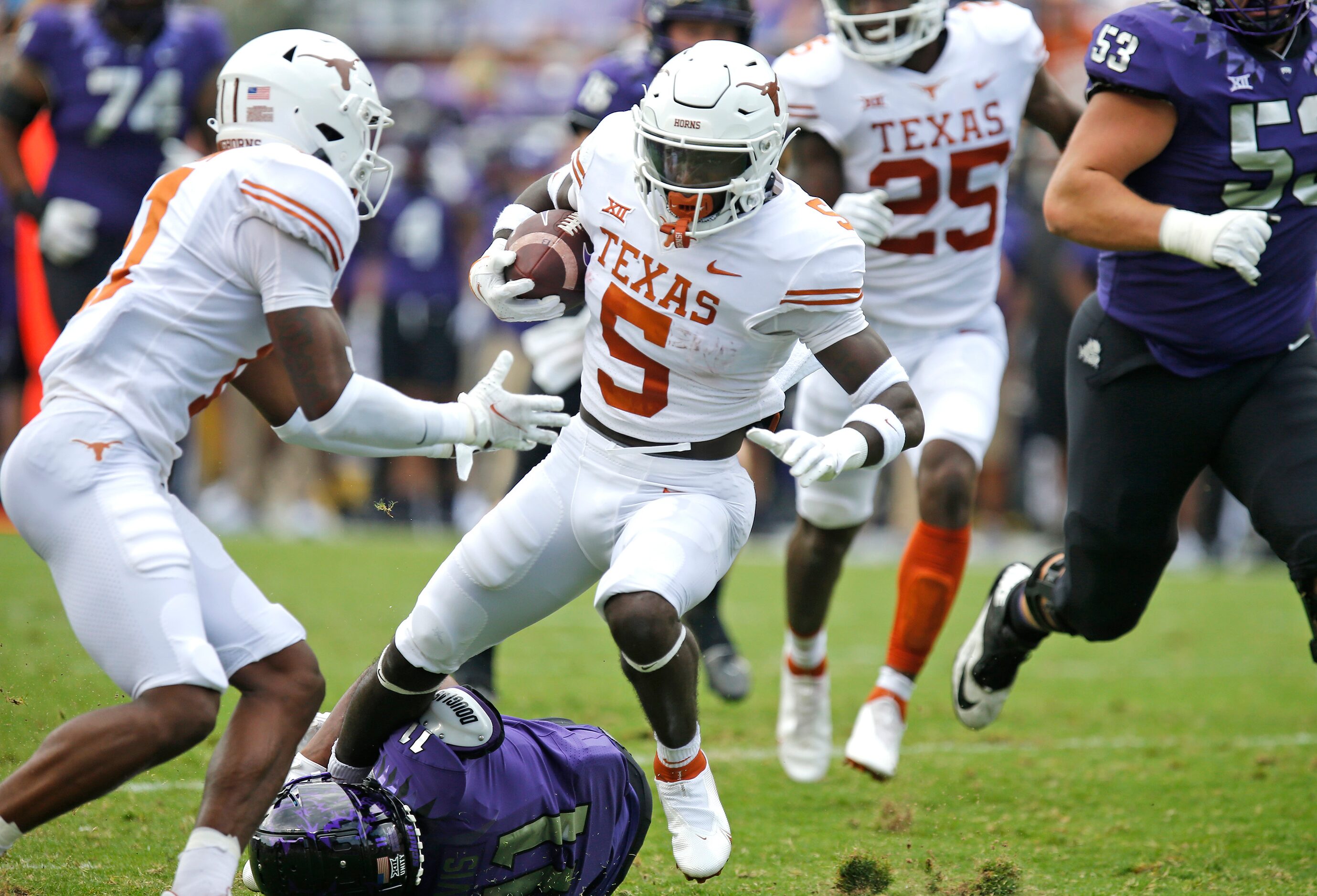 Texas Longhorns defensive back D'Shawn Jamison (5) returns a fumble recovery during the...