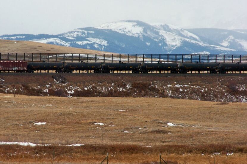 FILE- In this Nov. 7, 2013 file photo, a train hauls oil into Glacier National Park near the...