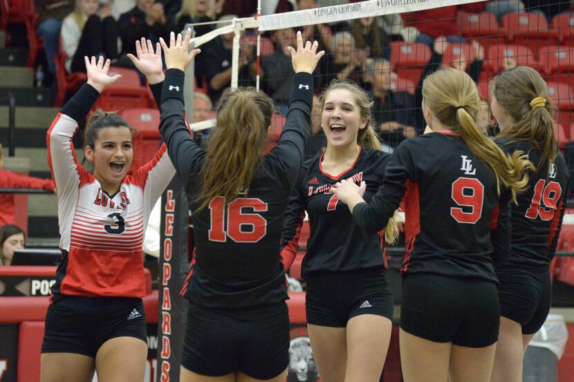 Lovejoy's Callie Kemohah (3) celebrates with teammates after the final point of their...