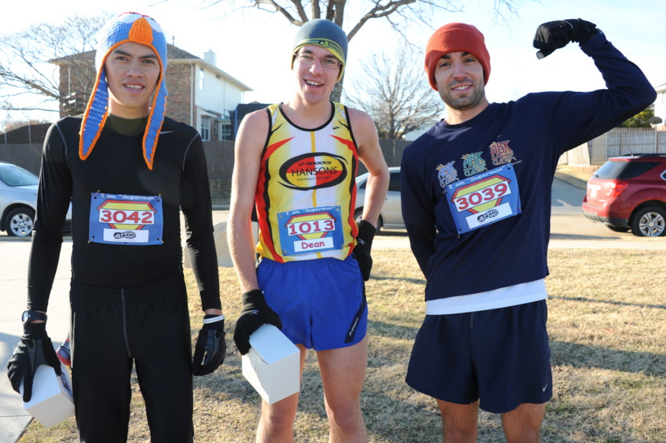 Top three men's runners Alfonso Mendoza, Dean Willis, and Nick DeSantis celebrate with their...