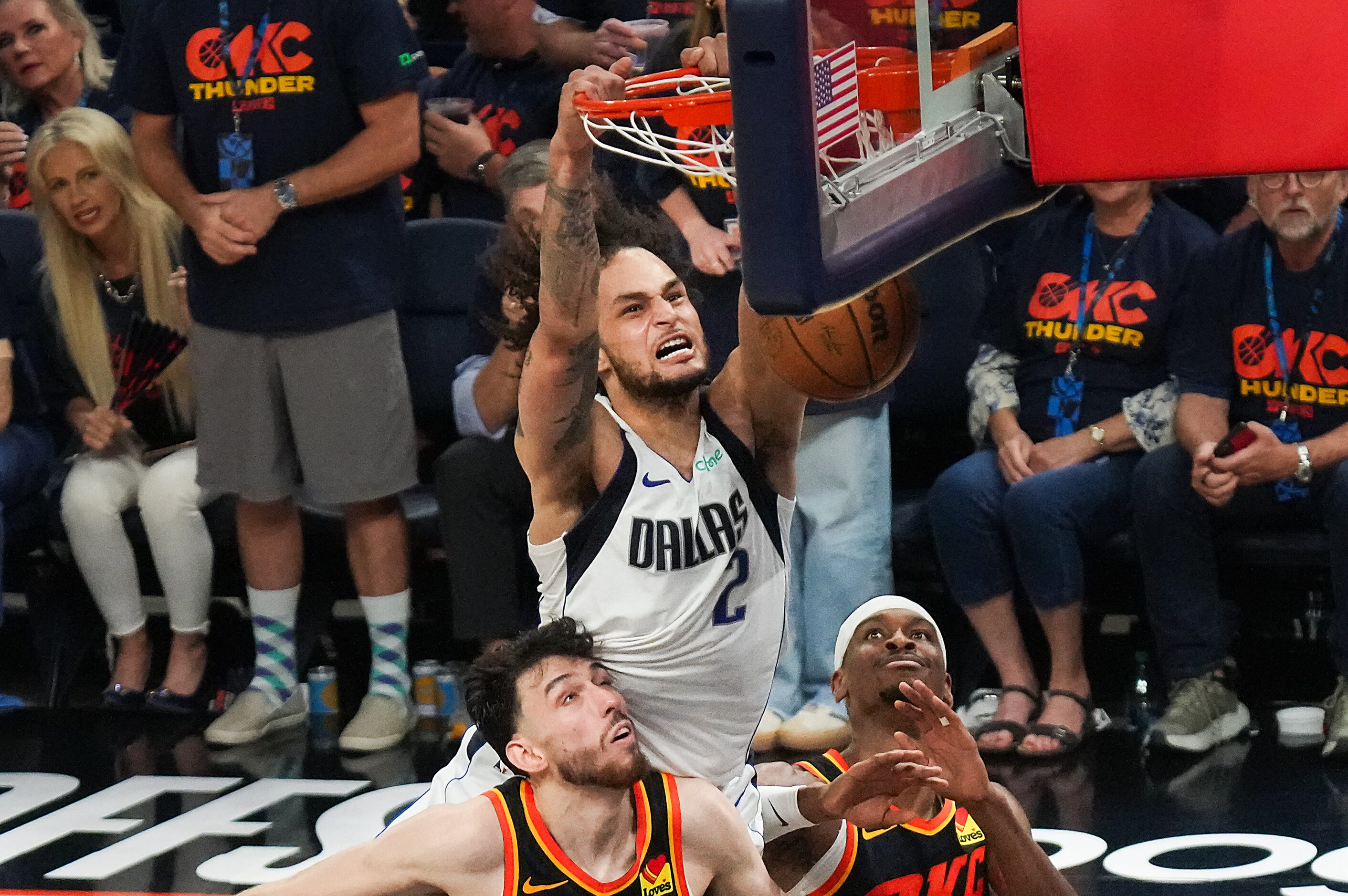 Dallas Mavericks center Dereck Lively II (2) dunks the ball over Oklahoma City Thunder...