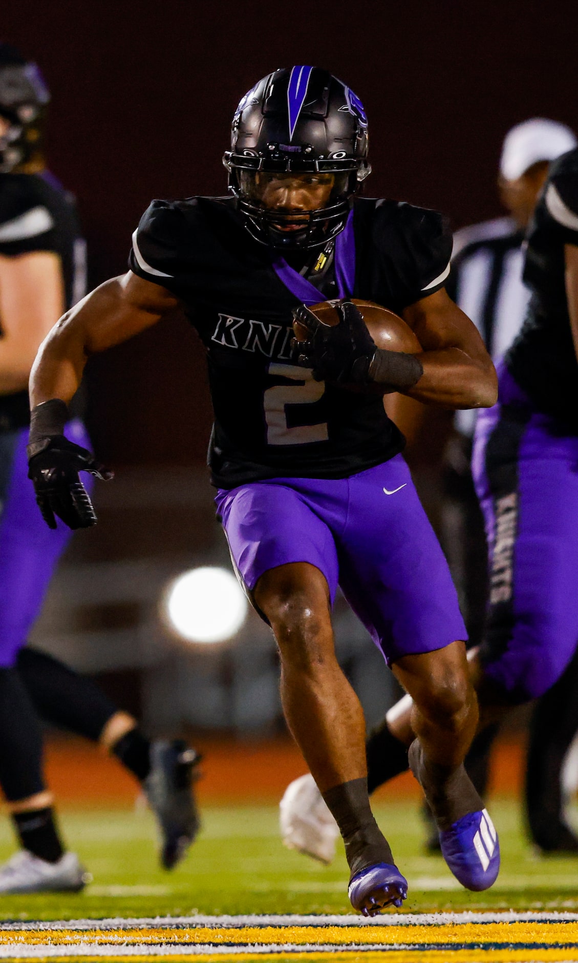 Frisco Independence’s running back Ude Enyeribe (2) runs against the Denton defense during...