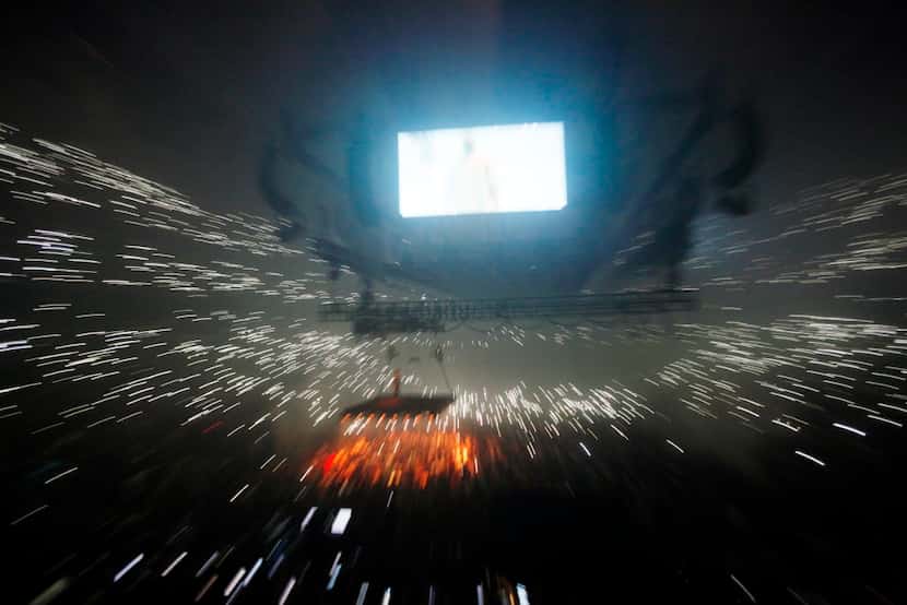 The American Airlines Center in Dallas is filled with the light of cell phones during a...
