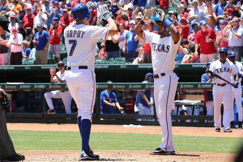 May 22, 2013; Arlington, TX, USA; Texas Rangers outfielder David Murphy (7) celebrates after...