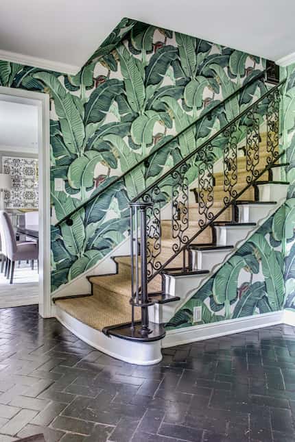 The tropical print wallpaper hints at the rest of this Dallas home's unique furnishings and...