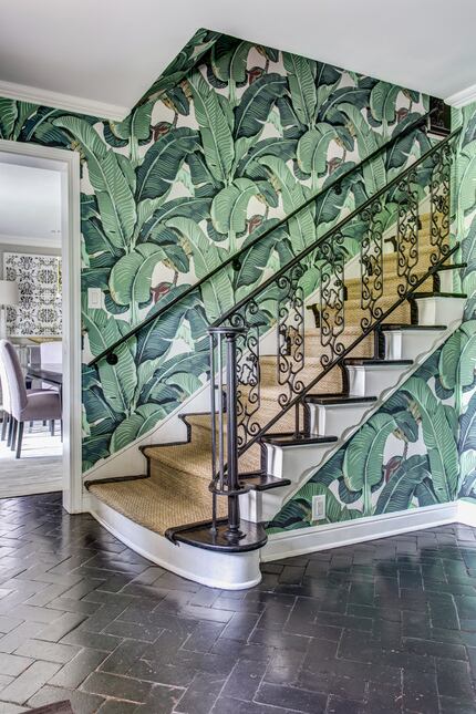 The tropical print wallpaper hints at the rest of this Dallas home's unique furnishings and...