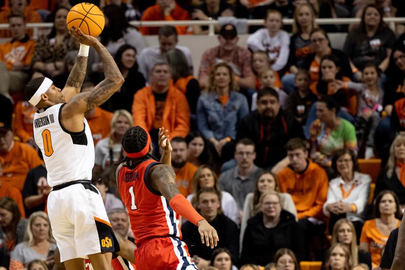Oklahoma State's Avery Anderson III (0) shoots over Mississippi's Amaree Abram (1) in the...