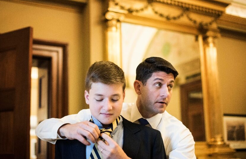 While meeting with staff, Speaker of the House Paul Ryan, R-Wis., ties a tie for his...