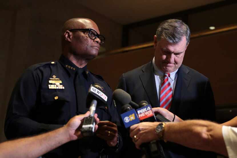 Dallas Police Chief David Brown and Mayor Mike Rawlings address the media following...