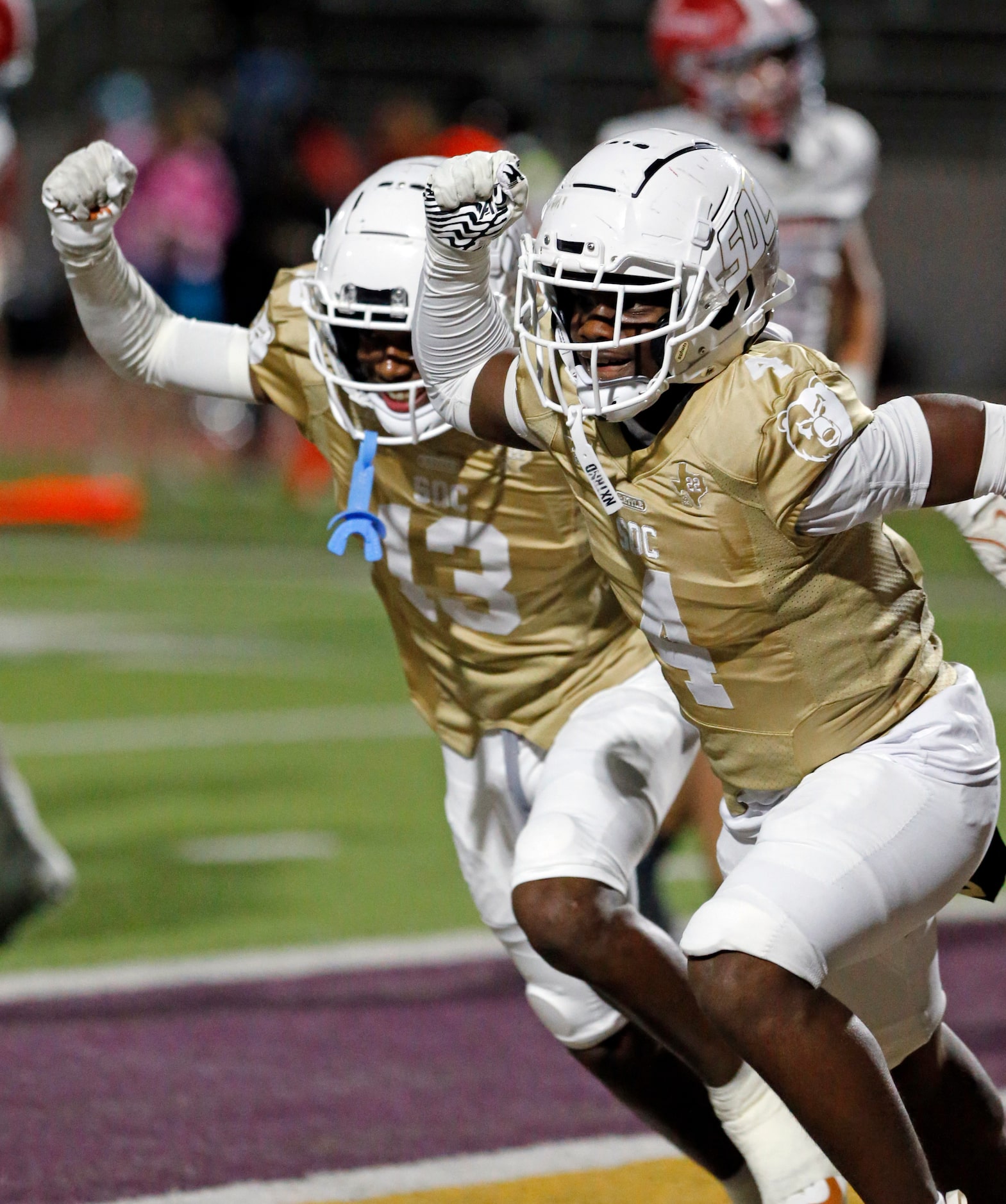 South Oak Cliff players Jalen Moore (13) and Levon Morton (4) celebrate during the first...