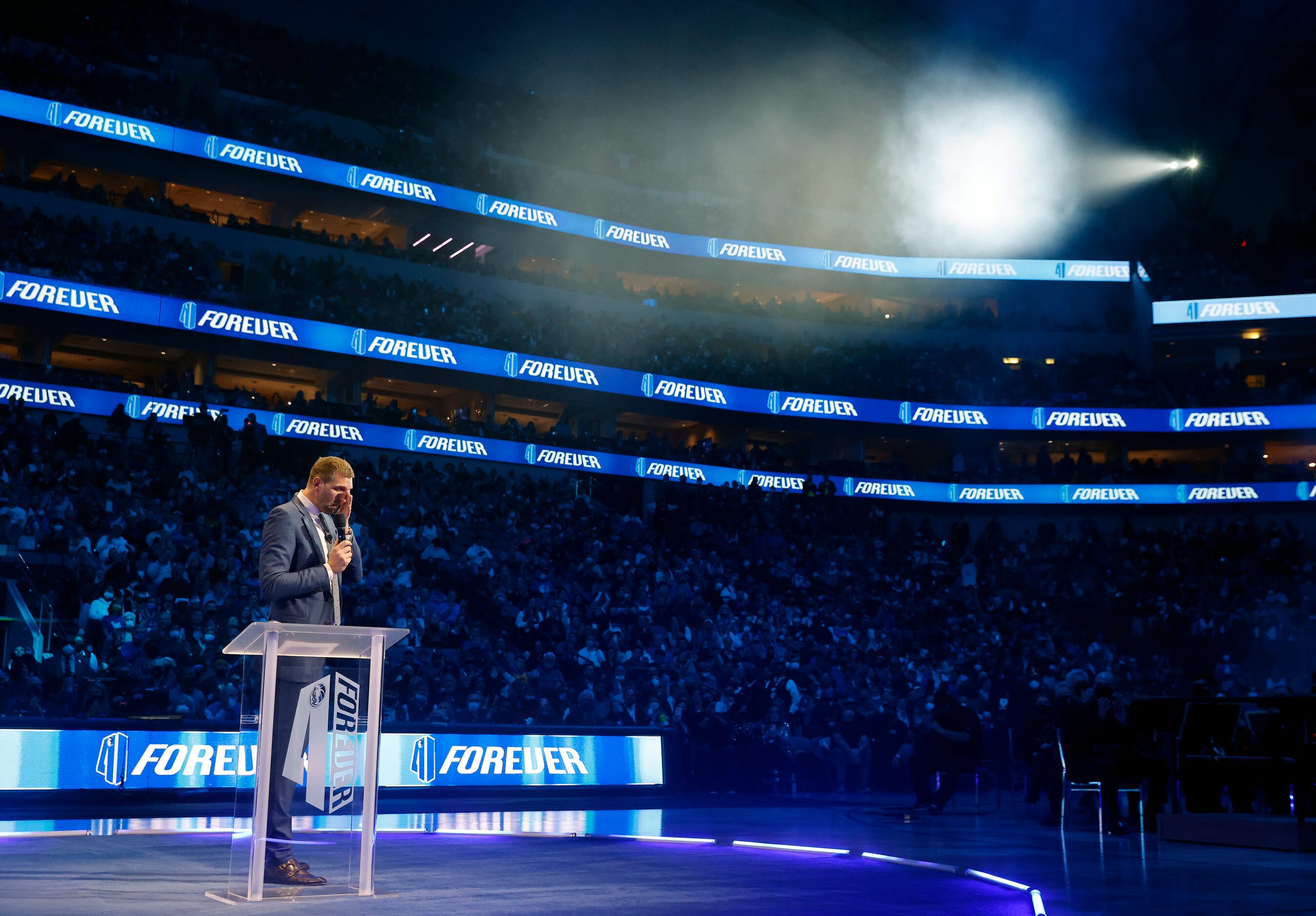 Former Dallas Mavericks All-Star Dirk Nowitzki and his family watch as his jersey is lifted...