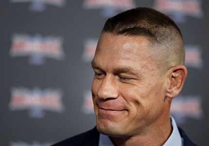 John Cena smiles as he fields a question during a press event at Reunion Tower in Dallas....