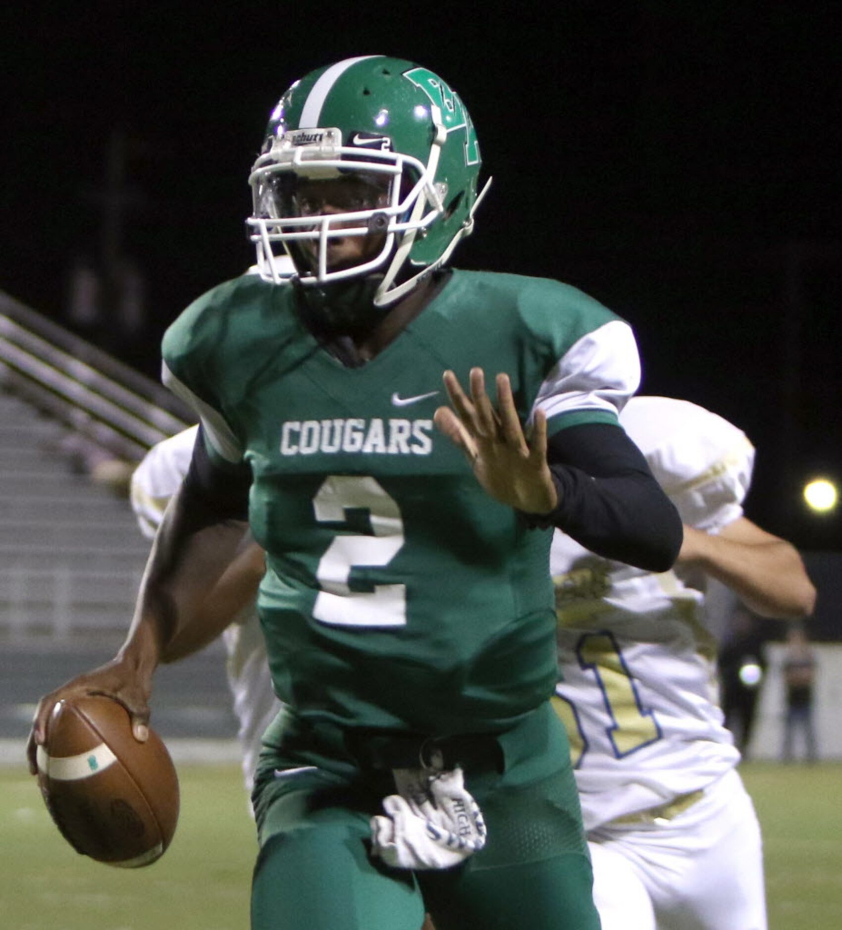 Bryan Adams quarterback XaiyViyon Mccuin (2) rushes into the Conrad secondary for a first...