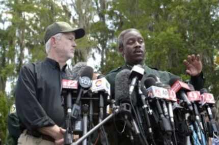  Nick Wiley (left), executive director of the Florida Fish & Wildlife Conservation...