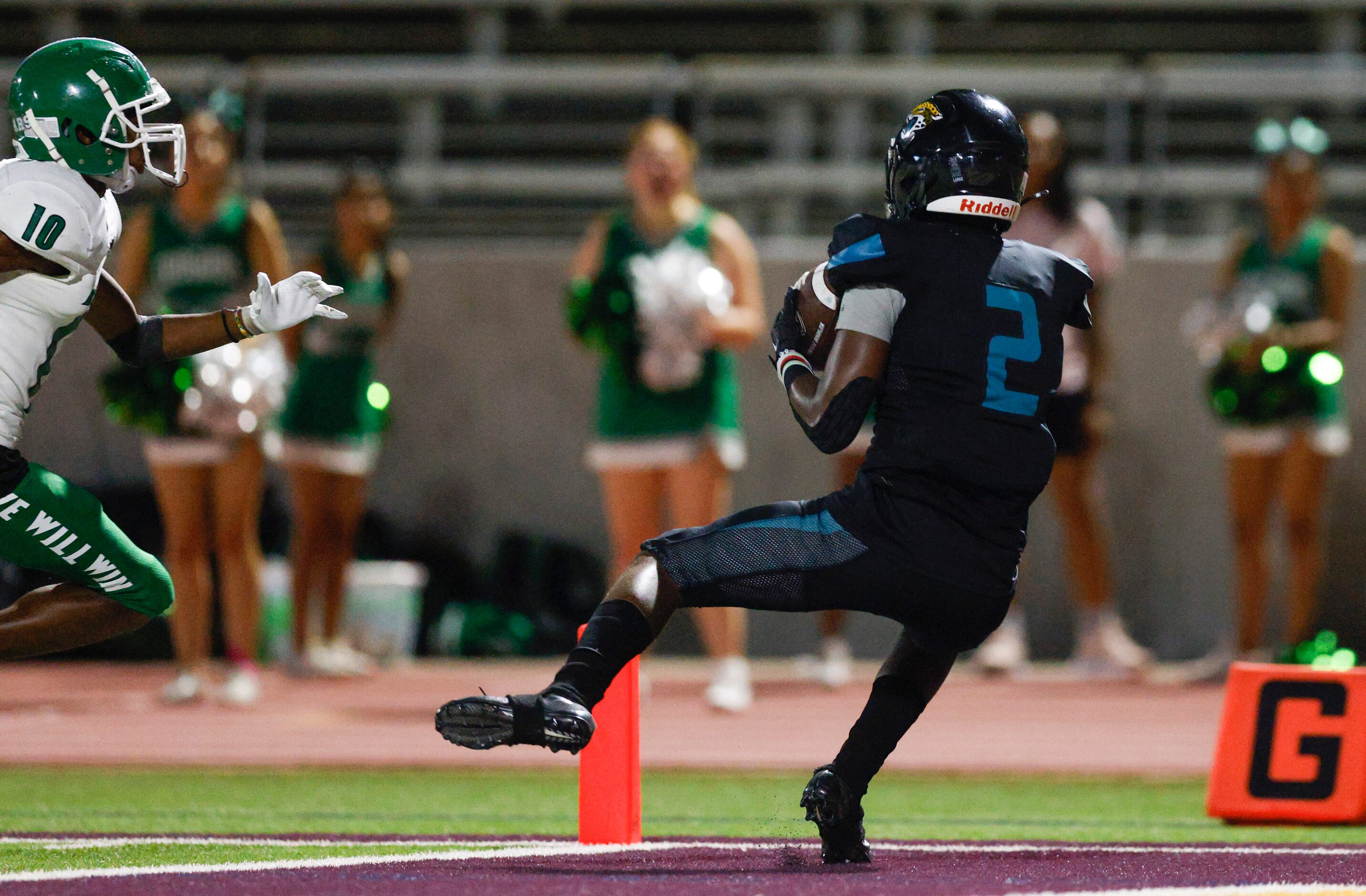 Molina wide receiver Mikaviion Jones (2) catches a pass in the end zone for a touchdown...