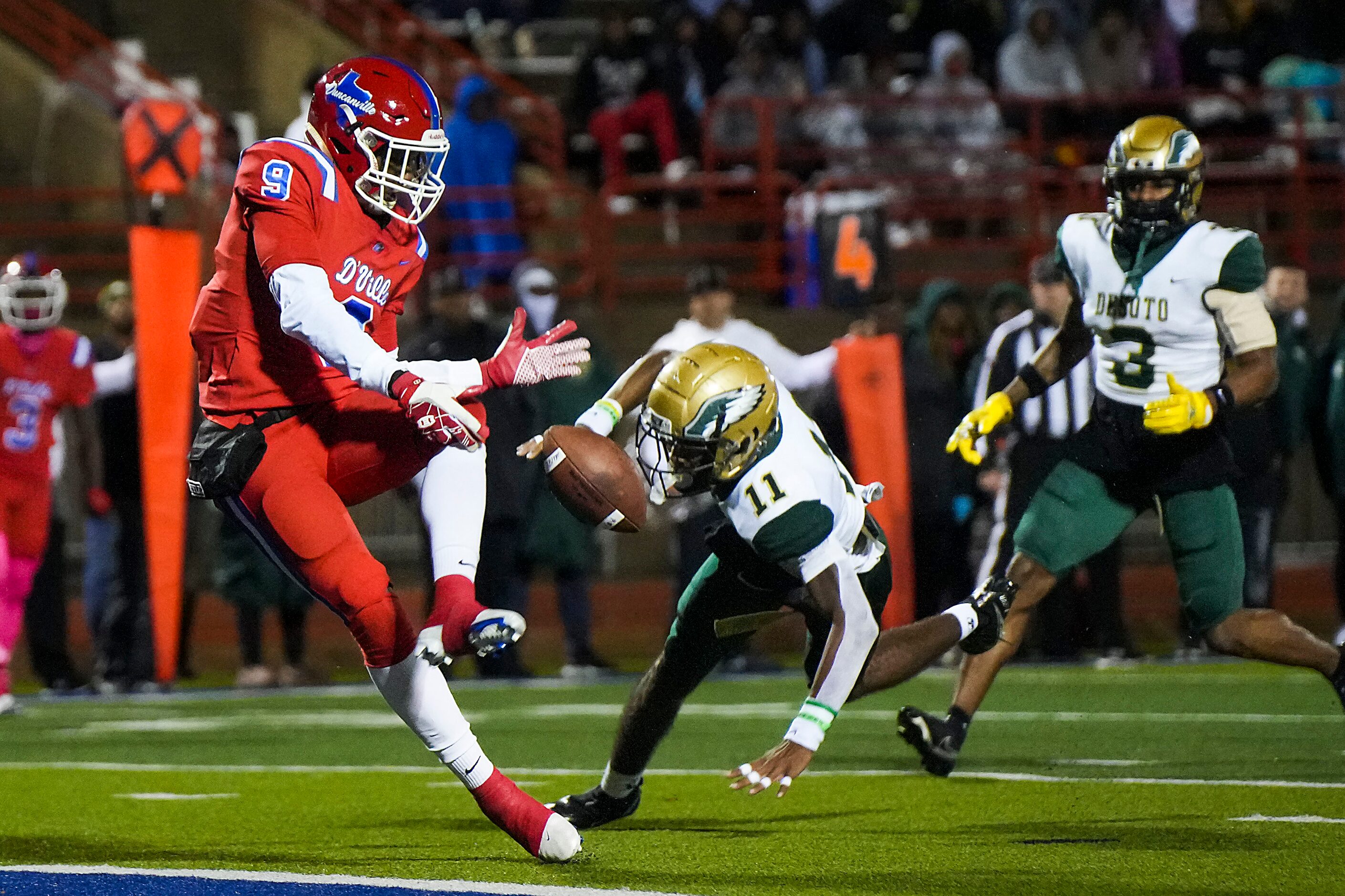 DeSoto defensive back DeMichael Porter (11) breaks up a pass intended for Duncanville...