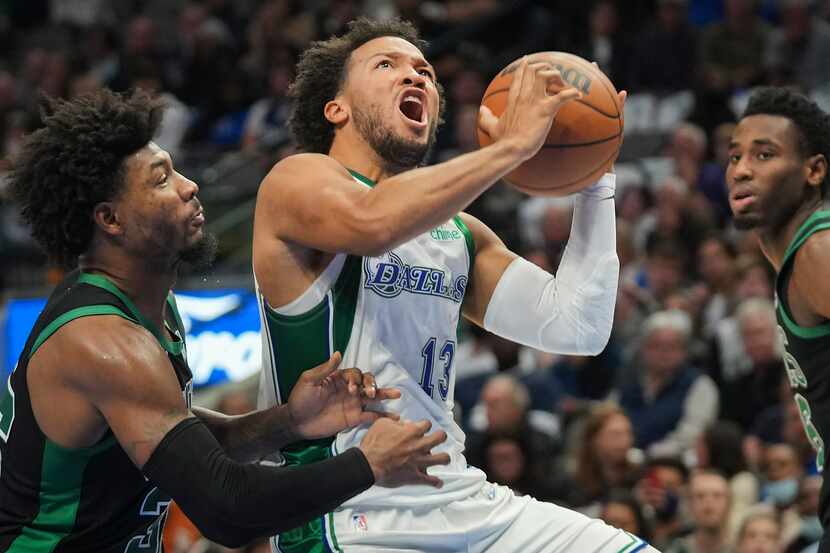 Dallas Mavericks guard Jalen Brunson (13) drives on Boston Celtics guard Marcus Smart (36)...
