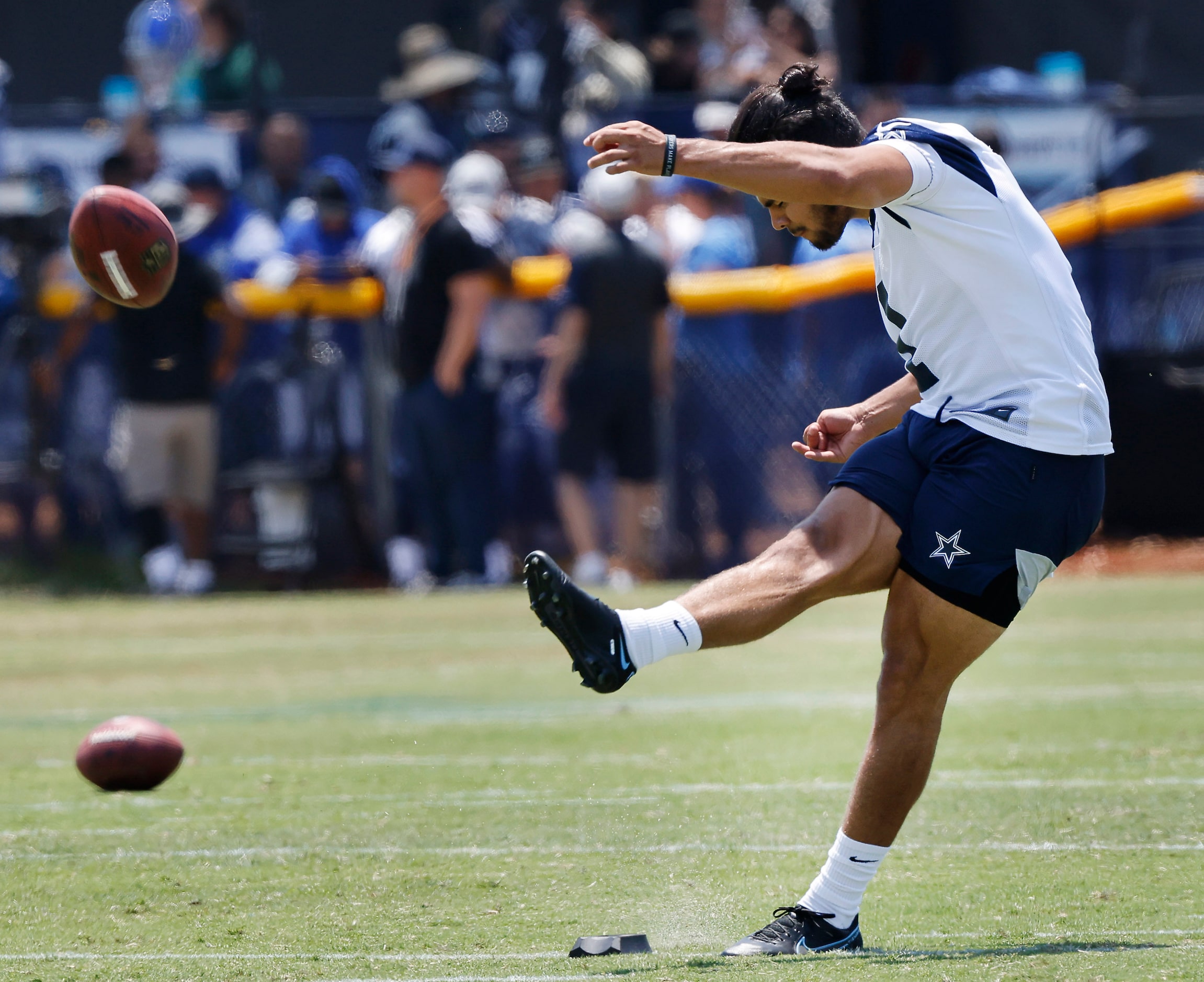 Dallas Cowboys kicker Jonathan Garibay (1) follows through on a long field goal attempt...