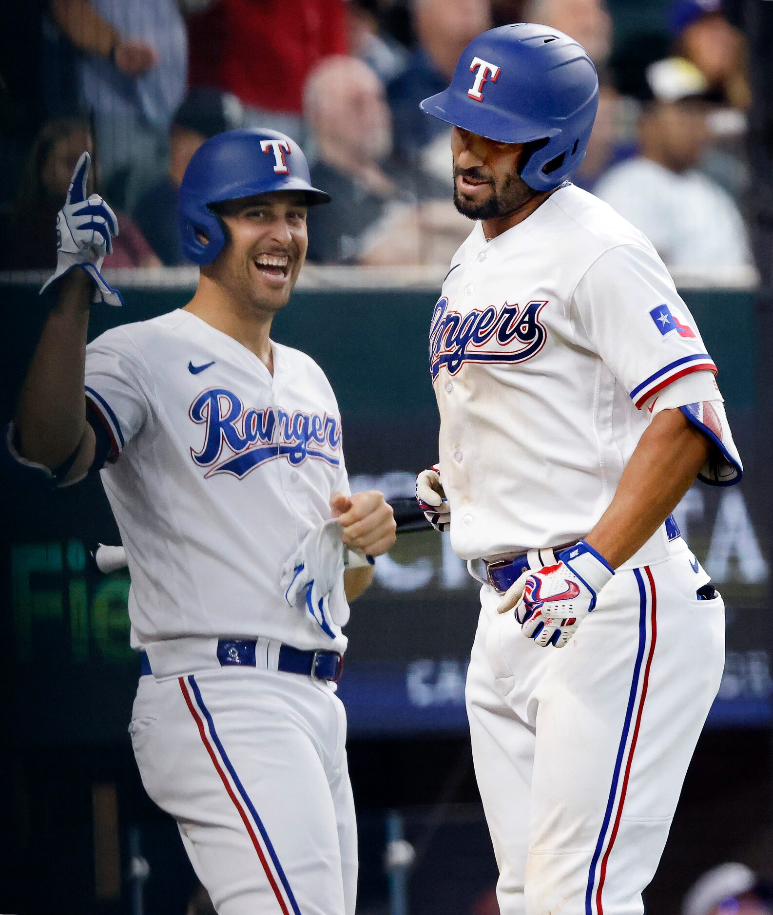 Texas Rangers second baseman Marcus Semien (right) is congratulated on his fourth inning...