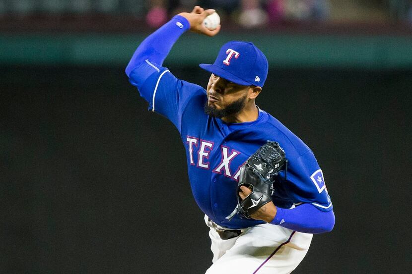 Texas Rangers relief pitcher Jeremy Jeffress pitches during the seventh inning against the...