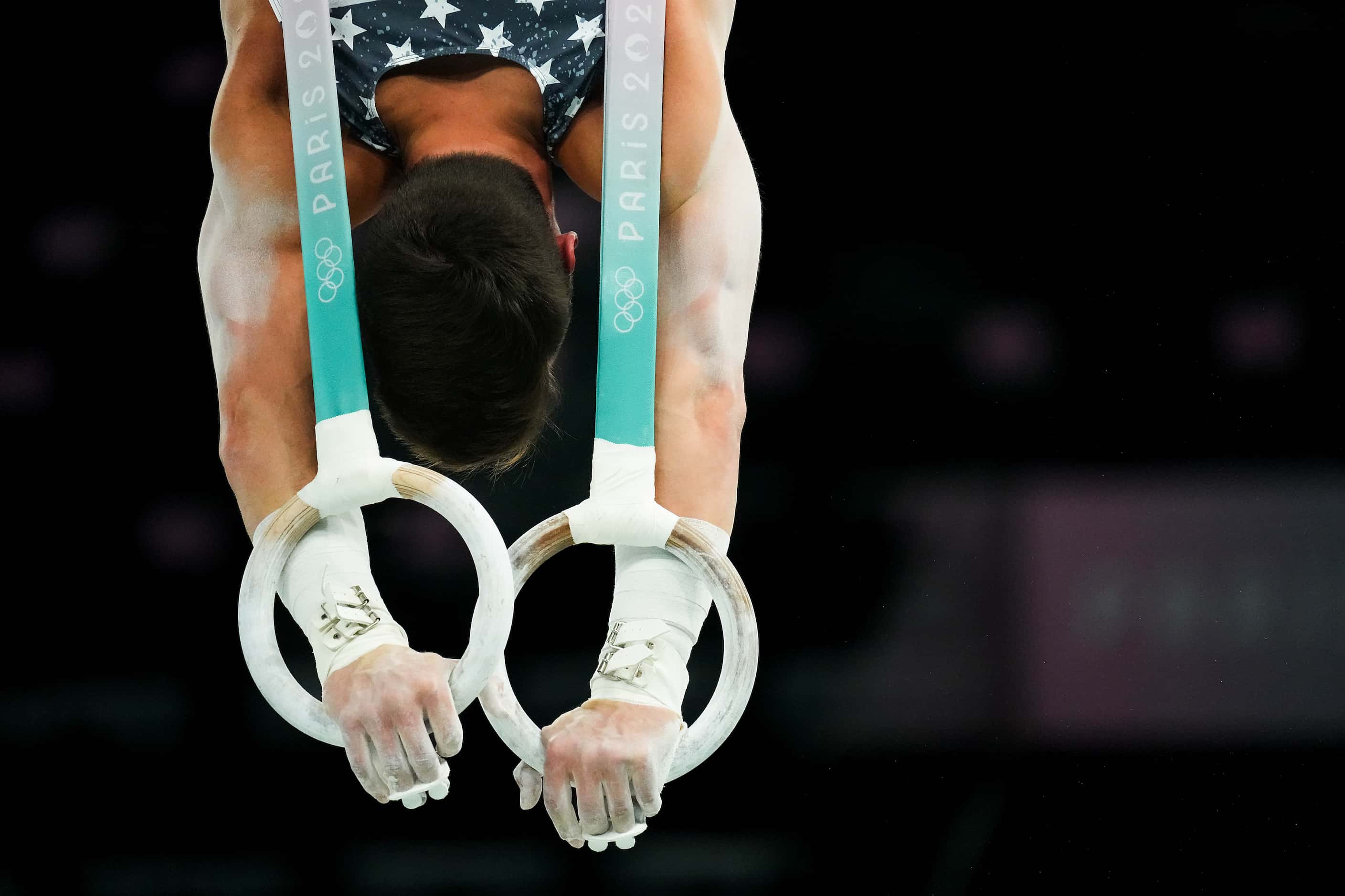 Brody Malone of the United States works on the rings during gymnastics podium training ahead...