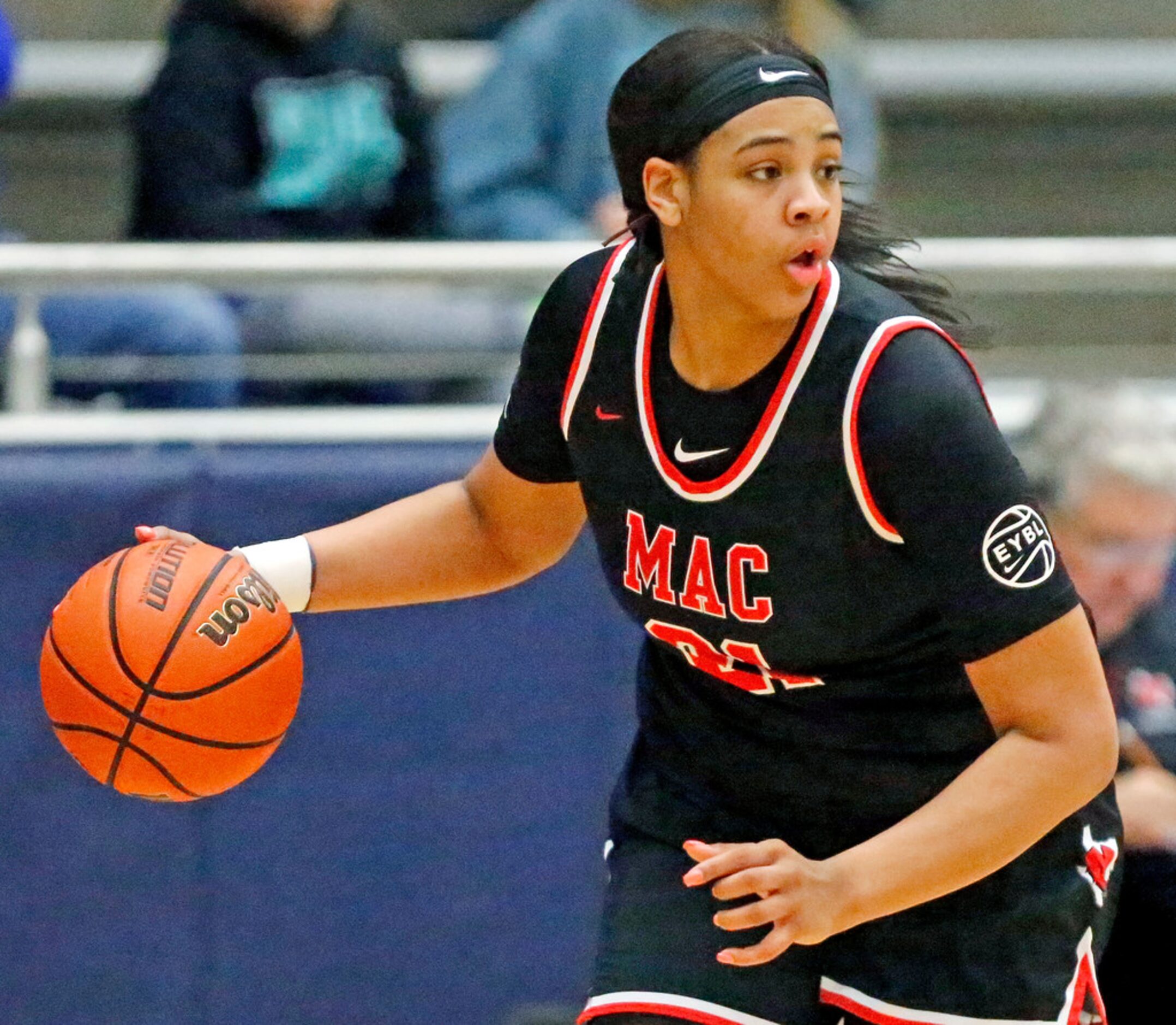 Irving MacArthur High School post Hannah Gusters (21) looks to make a pass during the second...