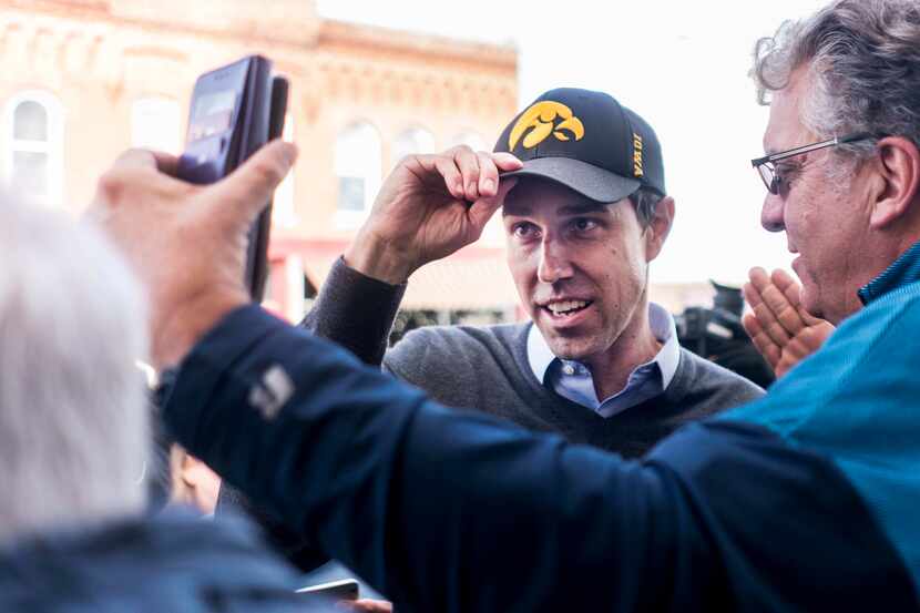 Newly announced 2020 Democratic presidential candidate Beto O'Rourke adjusts his new Iowa...
