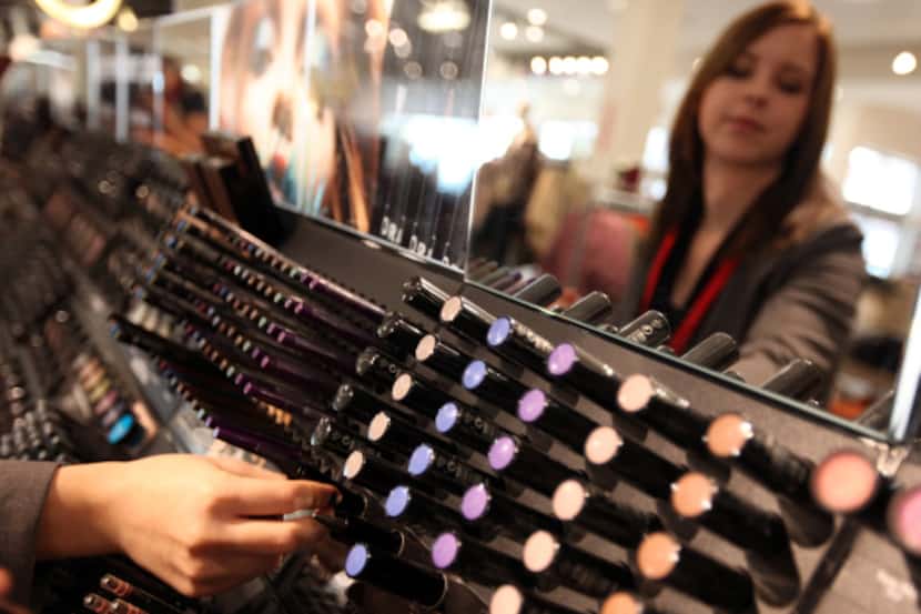 Michele Branch organizes the Sephora department at the new J.C. Penney at Northwest Highway...
