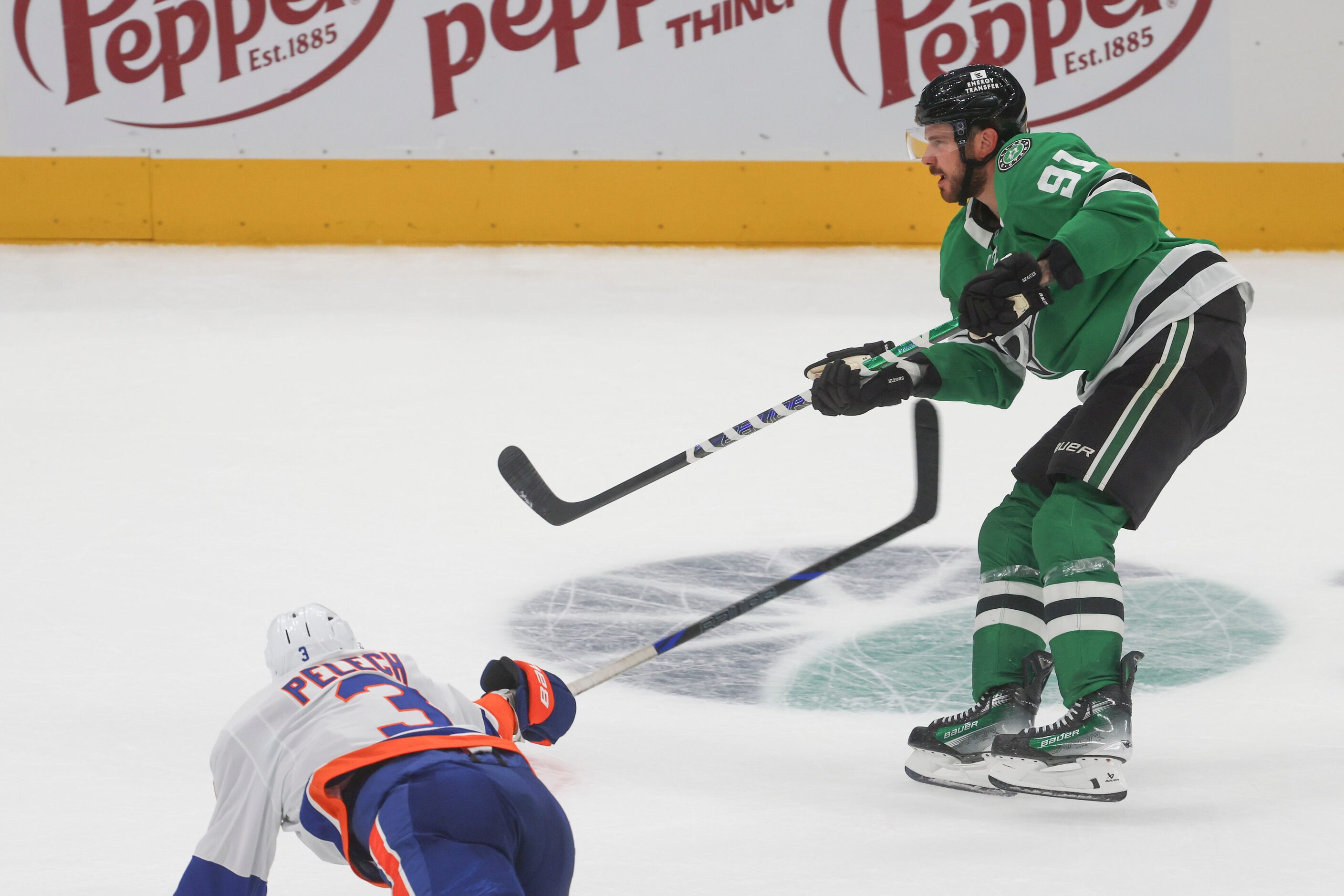 Dallas Stars center Tyler Seguin shoots for the team’s third goal past New York Islanders...