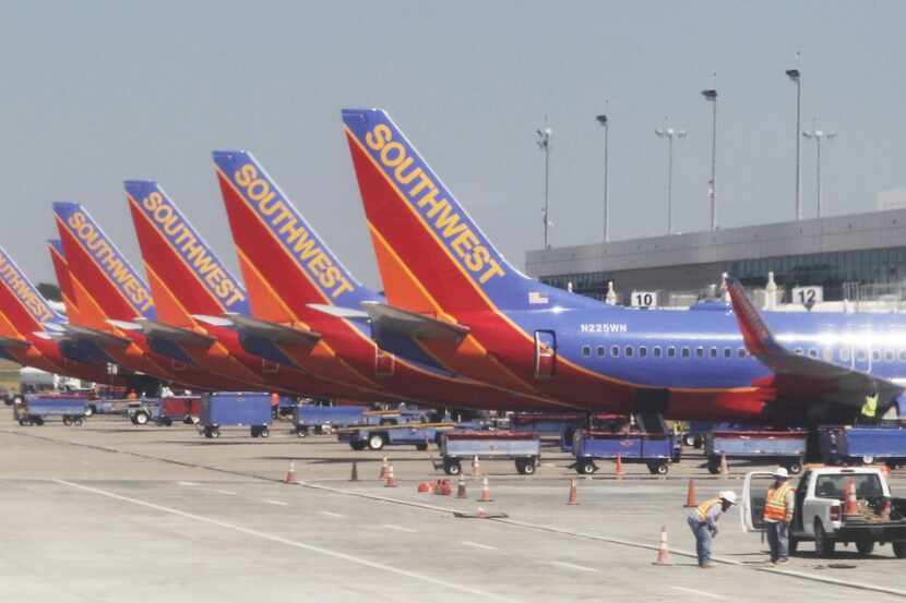  Southwest Airlines planes lined up at terminals at Dallas Love Field Airport in Dallas....
