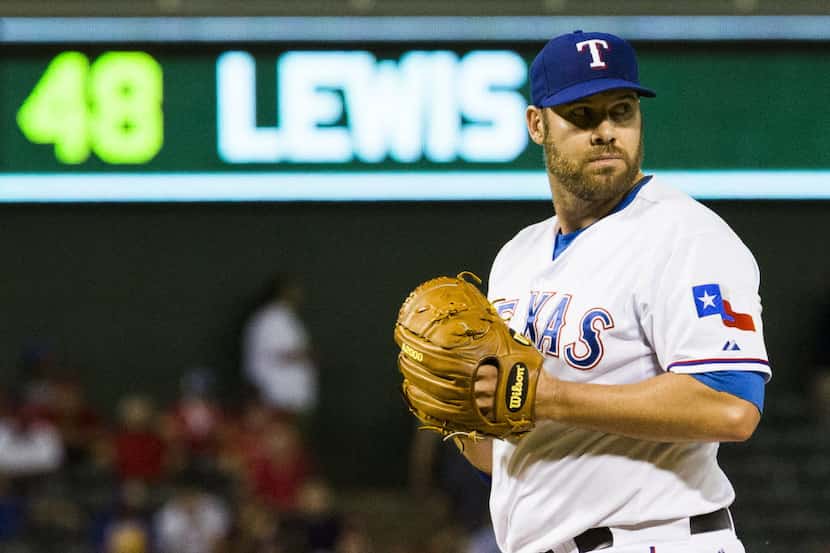 Texas Rangers pitcher Colby Lewis (48) pitches during the ninth inning of their game against...