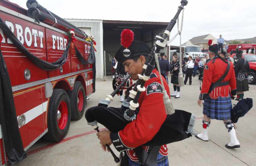 Jim Royer (foreground) and Bob Tramel of the Dallas Fire Department's pipe and drum corps,...