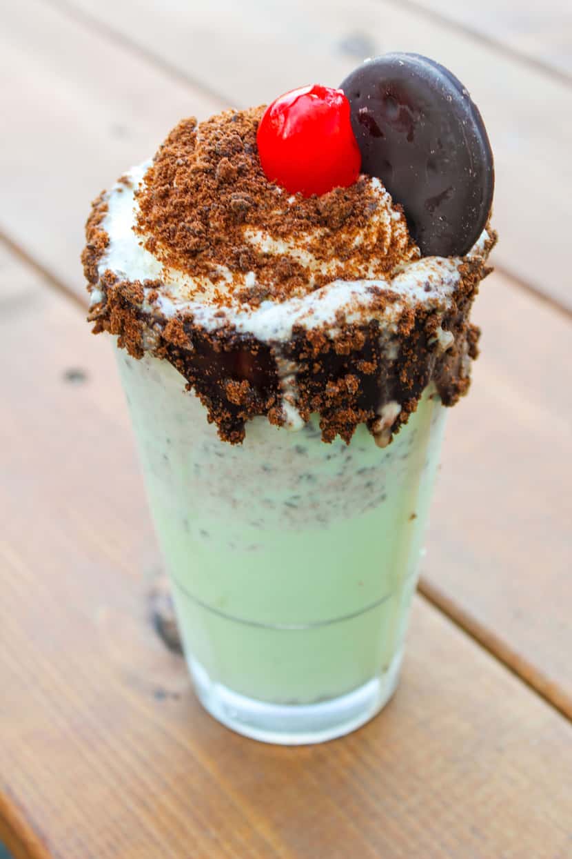 The Green Monster Milkshake is made with Thin Mints at The Owners Box at the Omni Dallas.