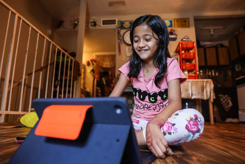 Zakirah Binti Mohammad Yasin, 7, attends a tutoring session by McShan Elementary School from...