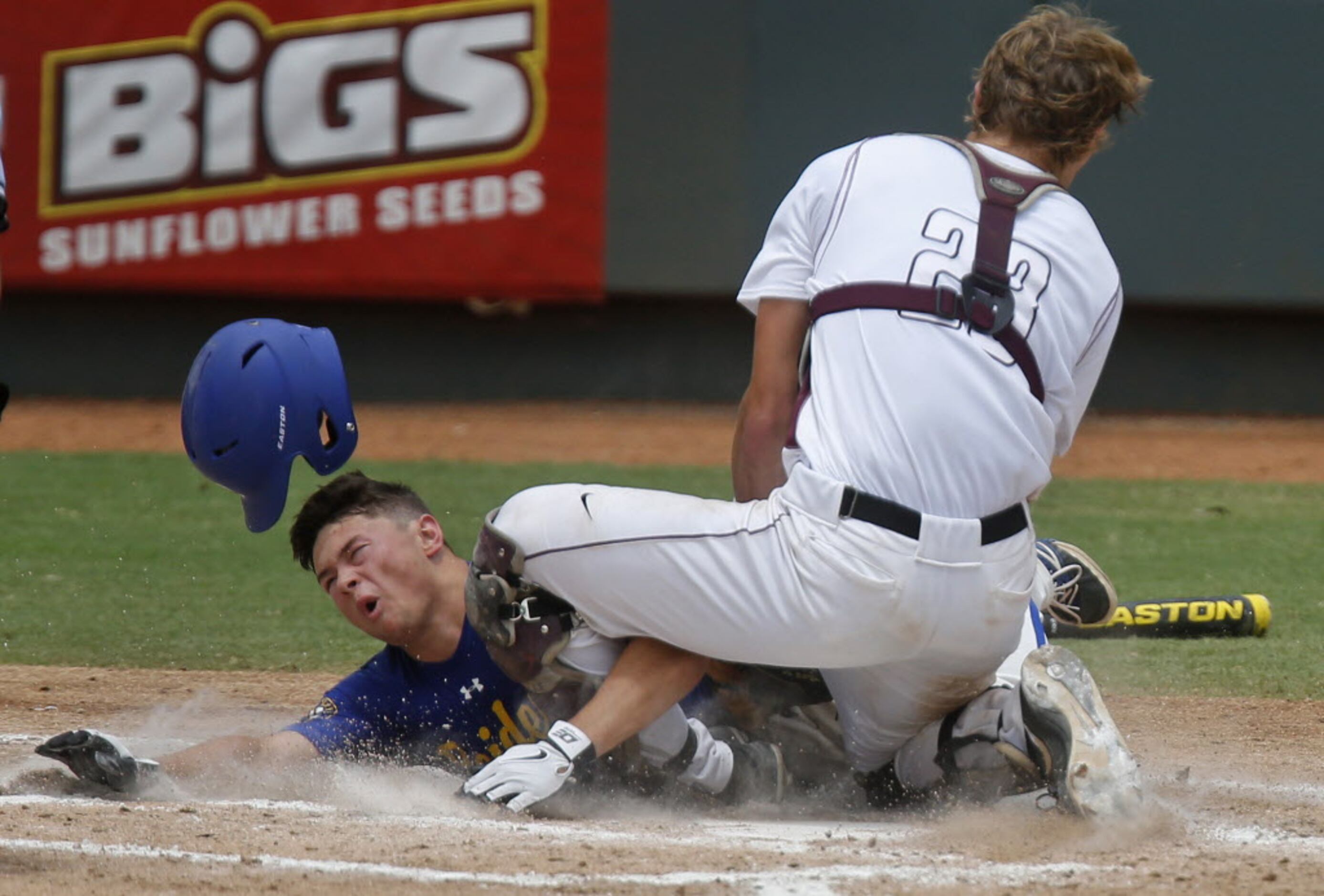 Sunnyvale's Joey Rosato (11) dives home with a third inning run and collides with Troy...