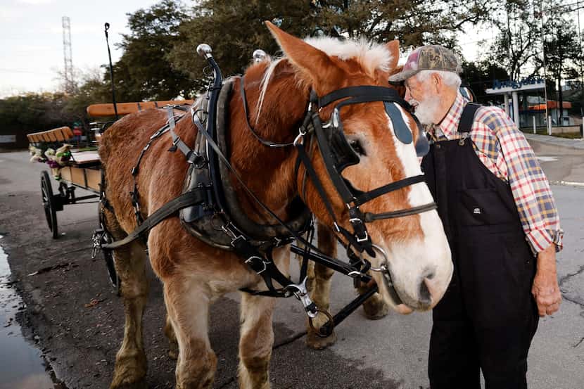 Melvyn High, 82, co-owner of NorthStar Carriages, talks with horses Dec. 24, 2023, in...