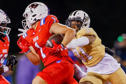 Parish Episcopal’s wide receiver Derek Eusebio (1) runs from South Oak Cliff’s line backer...