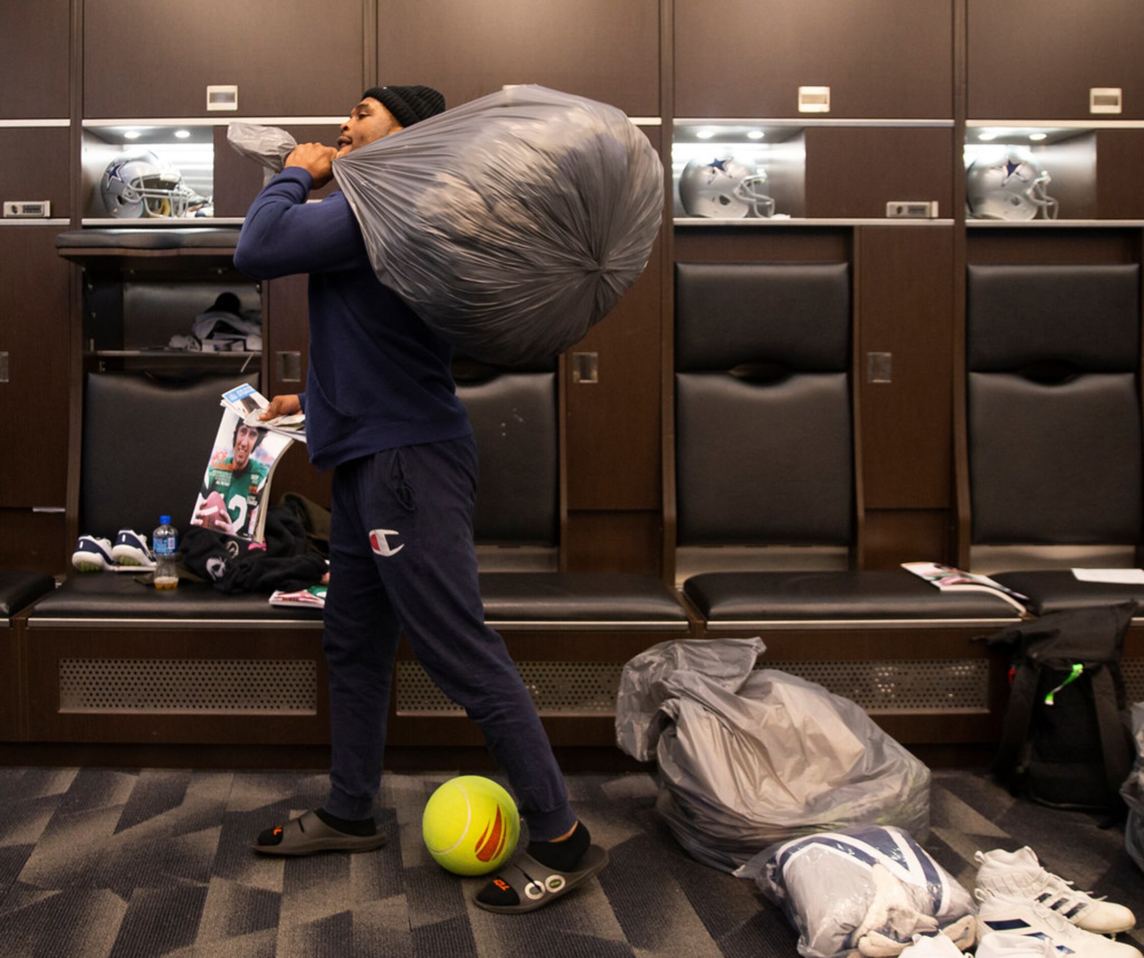 Trash bags filled with Dallas Cowboys players stuff after failing to make it to playoffs in...